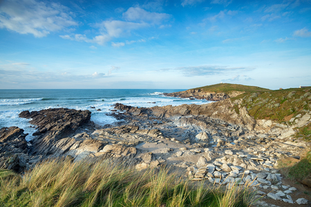 The South West Coast Path as it approaches the Towan Headland from Fistral Beach in Newquay on the Cornish coastの写真素材
