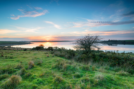 Stunning sunset over Colliford Lake on Bodmin Moor in Cornwallの写真素材