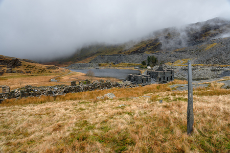 The ruins of abandoned cottages at Cwmorthin Slate Quarry at Tanygrisiau in north Walesの写真素材