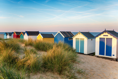 Brightly coloured beach huts at Southwold on the Suffolk coastの写真素材