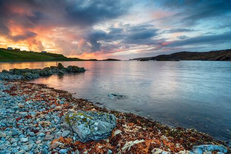 Dramatic sunset over the beach at Scourie Bay in the far north west of Scotlandの写真素材
