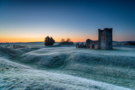 A frosty dawn over the old church at Knowlton near Wimborne in the Dorset countrysideの写真素材