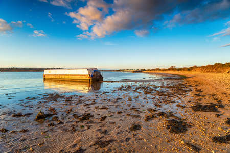 A sunny evening at Bramble Bush Bay at Studland on the Dorset coatlineの写真素材