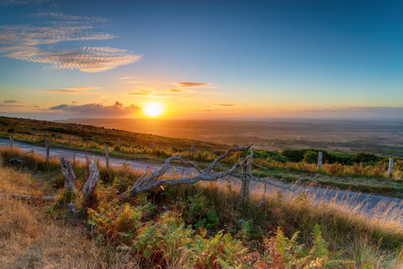 Sunset over the Lulworth ranges in the Purbeck Hills in Dorsetの写真素材