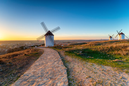 Sunset over Manchegos windmills at  Mota del Cuervo, in Cuenca, Spainの写真素材