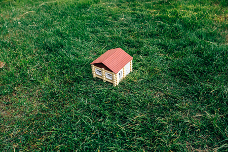 the wooden house from a log against a grassの写真素材