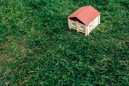 the wooden house from a log against a grassの写真素材