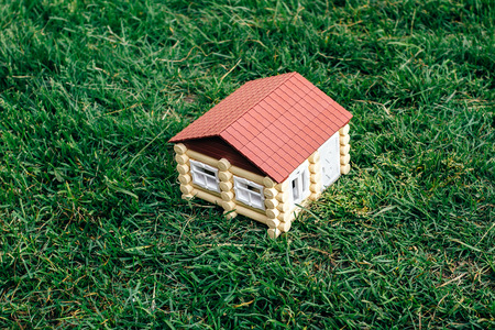 the wooden house from a log against a grassの写真素材