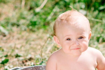 Portrait of the little girl against the natureの写真素材
