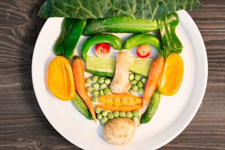 many different vegetables are laid out on a plateの写真素材