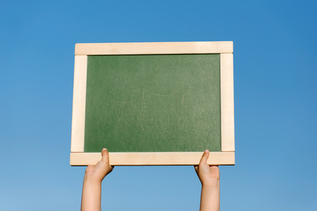 board or background in hands of the personの写真素材