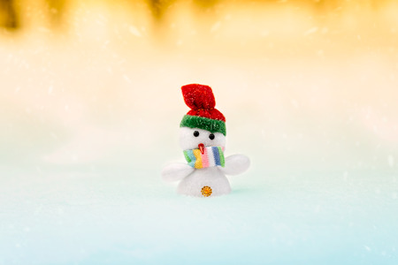Christmas or New Year's background with space. The snowman standing in a winter Christmas landscape. Snow background.の写真素材
