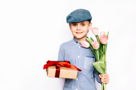 the beautiful boy gives flowers and a giftの写真素材