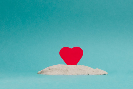 red heart on blue backgroundの写真素材