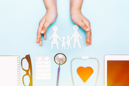 Background on medicine with stethoscope, medicine, tablet and notepadの写真素材