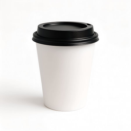 White paper coffee cup with black cap isolated on white background. 3d renderの素材