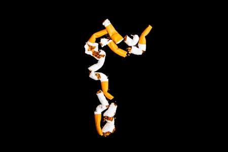 Cigarettes with a filter on a black backgroundの写真素材