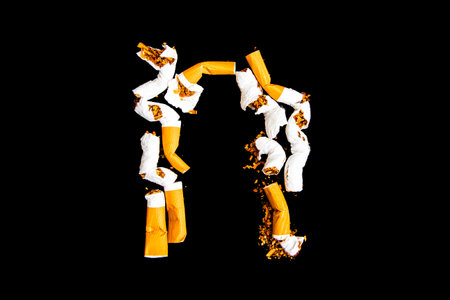 Cigarettes with a filter on a black backgroundの写真素材