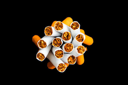 Cigarettes with a filter on a black backgroundの写真素材