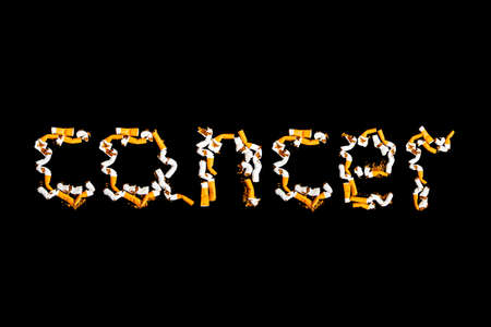 Cigarettes with a filter on a black backgroundの写真素材