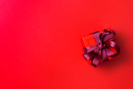 Gift box on a red backgroundの写真素材