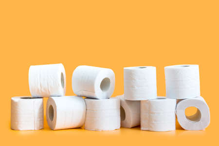 Toilet paper roll on yellow backgroundの写真素材