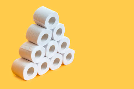 Toilet paper roll on yellow backgroundの写真素材