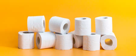 Toilet paper roll on yellow backgroundの写真素材