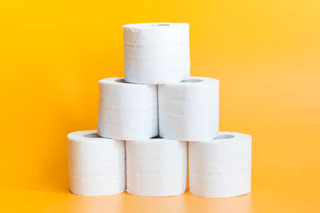 Toilet paper roll on yellow backgroundの写真素材