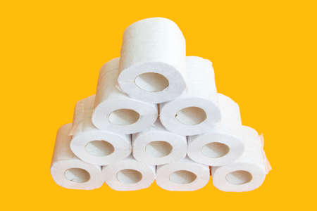 Toilet paper roll on yellow backgroundの写真素材