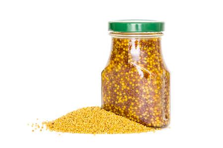 Mustard seeds on a white backgroundの写真素材