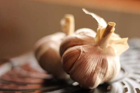 Close up of garlic on a black grill