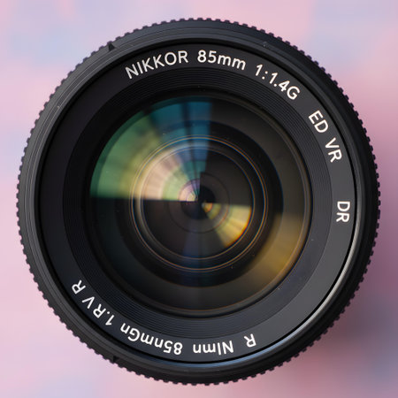 Close-up of a camera lens on a blurred background with textの素材