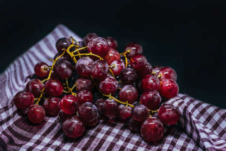 Fresh grapes and purple grape juice on the tableの写真素材