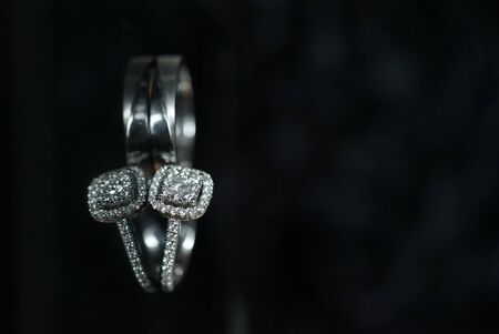 Diamond wedding rings close up decorated nautical with accessories for Malay wedding isolated on black backgroundの写真素材