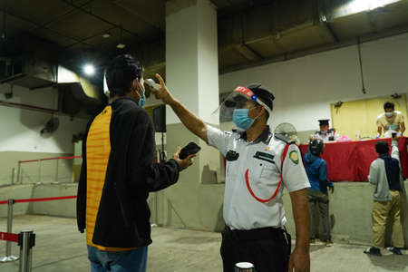 Kuala Lumpur, Malaysia - May 15 2020: New normal, people are required to scan the temperature body...