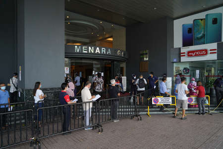 Menara PGRM, Malaysia, May 14, 2020 : Gathering of people for make appeal for Bantuan Prihatin Nasional (BPN) by government Malaysia. They follow the new normal situation, social distancing, wear maskのeditorial素材