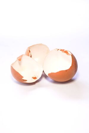 Brown chicken eggshell isolated on white backgroundの写真素材
