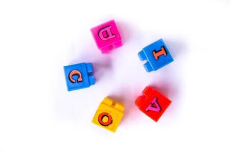 Covid words are arranged in a rustic colorful lego cube. Suitable for children. Isolated on white backgroundの写真素材