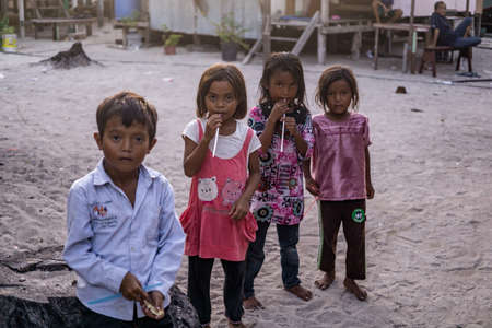 Mabul Island, Sabah, Malaysia - Aug 08, 2018: A happy face and enjoy of the Kids life on Mabul Island, they play with everything around themのeditorial素材