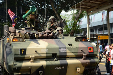 KUALA LUMPUR, MALAYSIA-31st August 2017; Celebrating Malaysia Independence Day at Dataran Merdeka. All the soldier, police marching in group, and the crowd enjoy the performance with raised the flagのeditorial素材
