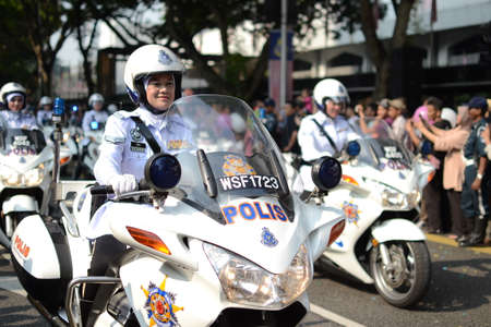 KUALA LUMPUR, MALAYSIA-31st August 2017; Celebrating Malaysia Independence Day at Dataran Merdeka. All the soldier, police marching in group, and the crowd enjoy the performance with raised the flagのeditorial素材