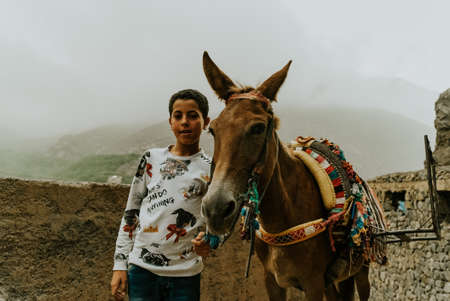 Morocco- September 28,2019 : Local people with horse at imlil, Moroccoのeditorial素材