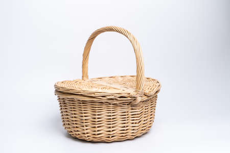 Basket wicker on isolated white background.