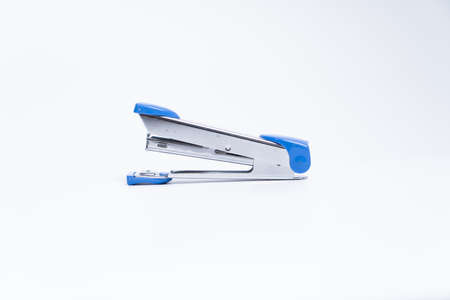 Blue stapler isolated on a white background.の写真素材