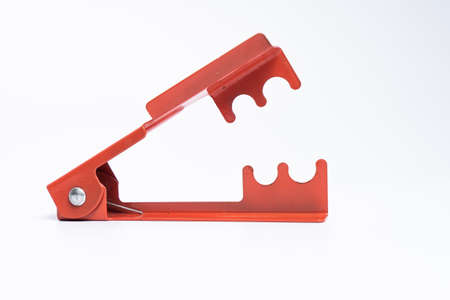 The red color of cutting tool DIY rose thorn remover isolated in white backgroundの写真素材