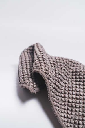 3 small kitchen towels, with recycled material in dark brown color. On the white background surface