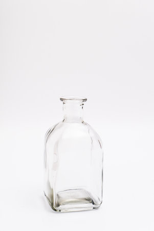 Transparent bottle without cap for interior decoration. Studio shot and isolated on white backgroundの写真素材