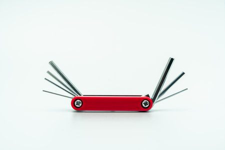 The red color of a bar wrench folding hexagonal. isolated on white backgroundの写真素材