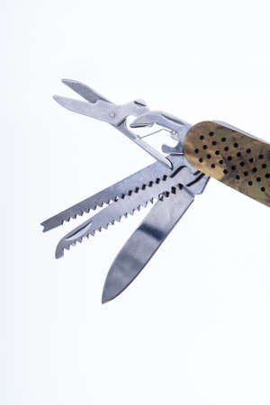 Multi-tool pocket folding with a camouflage pattern. Isolated with white backgroundの写真素材